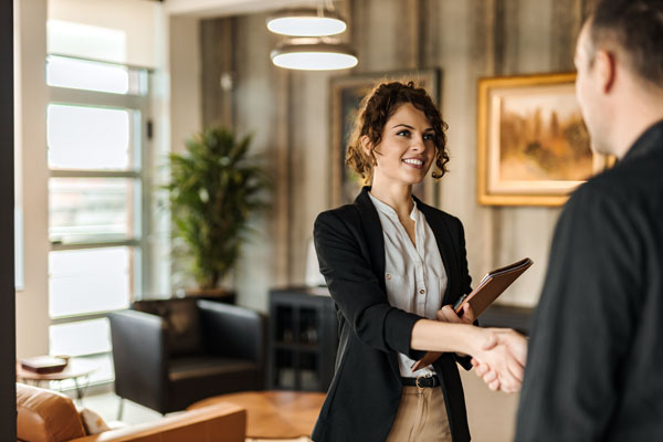 Image of a businesswoman shaking hands with a man