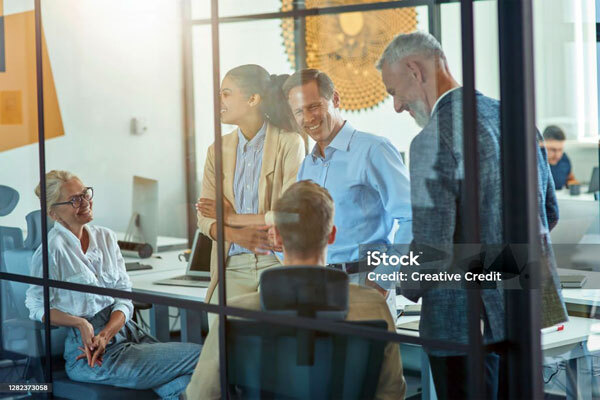 Image of a group of professionals in a meeting at the office