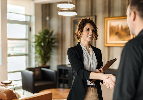 Image of a businesswoman shaking hands with a man